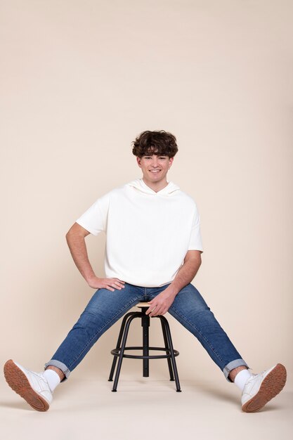 Full shot young man wearing white shirt