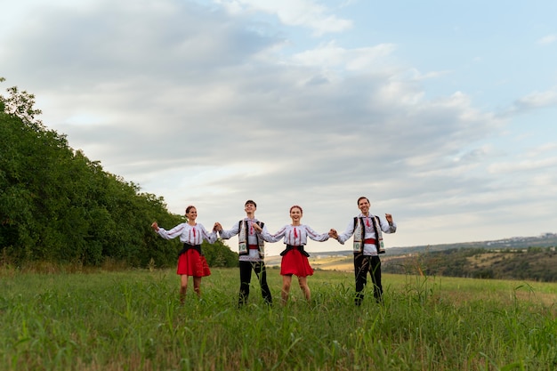 Free Photo full shot young people dancing together