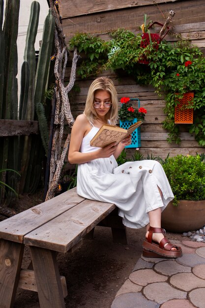 Full shot young woman surrounded by plants