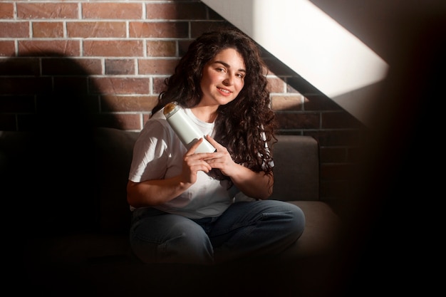 Full shot young woman with curly hair