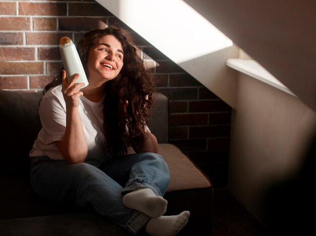 Full shot young woman with curly hair