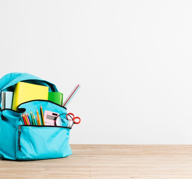 Full of stationery and books blue school backpack