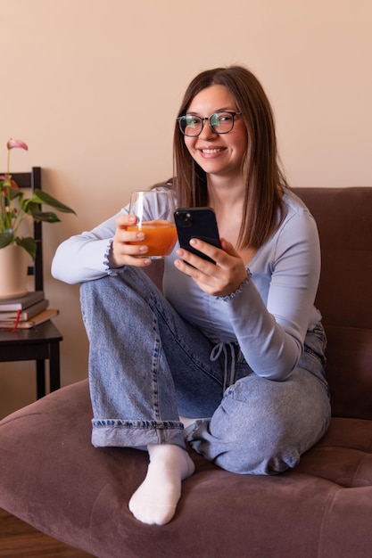 Full view of beautiful woman smile at camera and relaxing at home with fresh