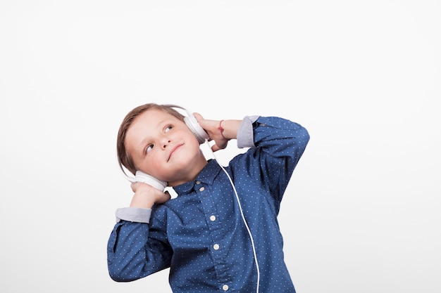 Funny boy listening to music