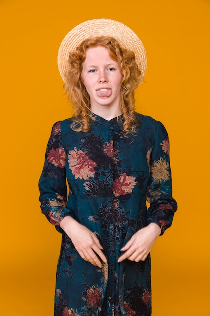 Free photo funny ginger young woman making faces