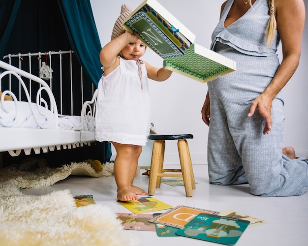 Funny girl emptying box with letter cards