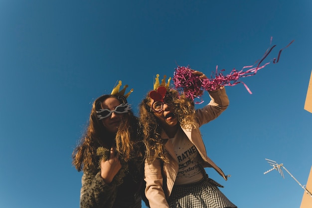 Funny girls with tinsel