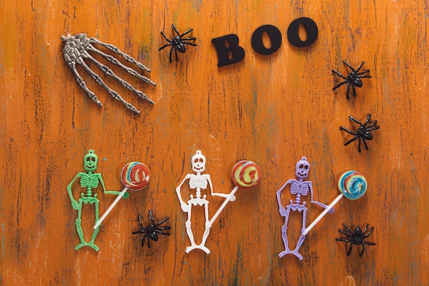 Funny plastic skeletons with lollipops