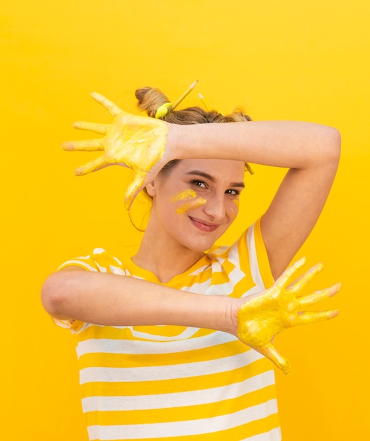 Free photo funny woman with painted hands