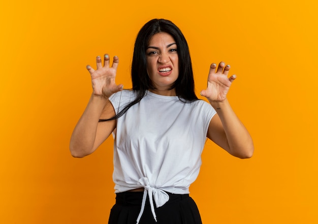 Funny young caucasian woman gesturing tiger paws