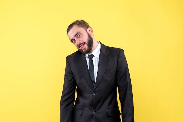 Free photo funny young man sticking out his tongue