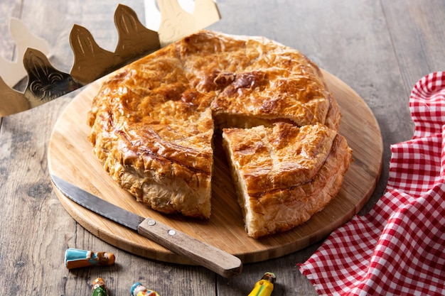 Galette des rois on wooden table.Traditional Epiphany cake in France