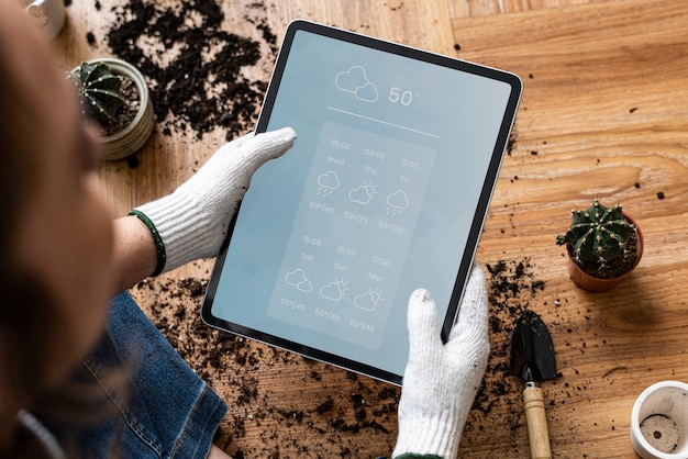 Free photo gardener looking at a water forecast