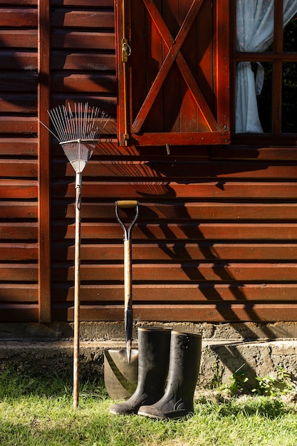 Gardener tools beside house