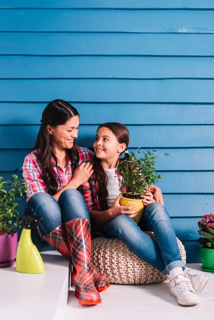 Gardening concept with mother and daughter