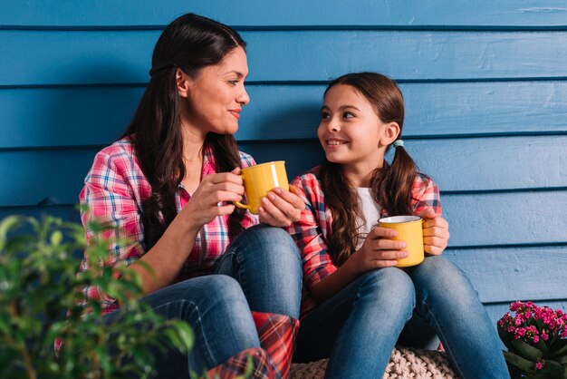 Gardening concept with mother and daughter