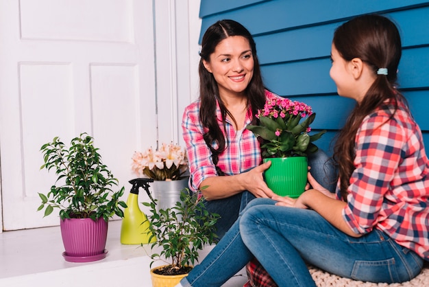 Gardening concept with mother and daughter