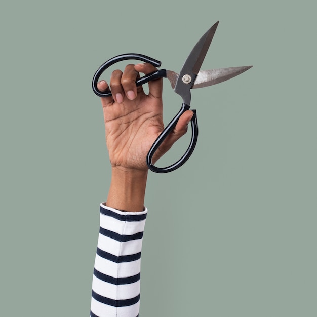 Free Photo gardening tool scissor held by a woman&amp;#39;s hand