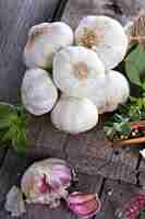 Free photo garlic heads on a wooden table