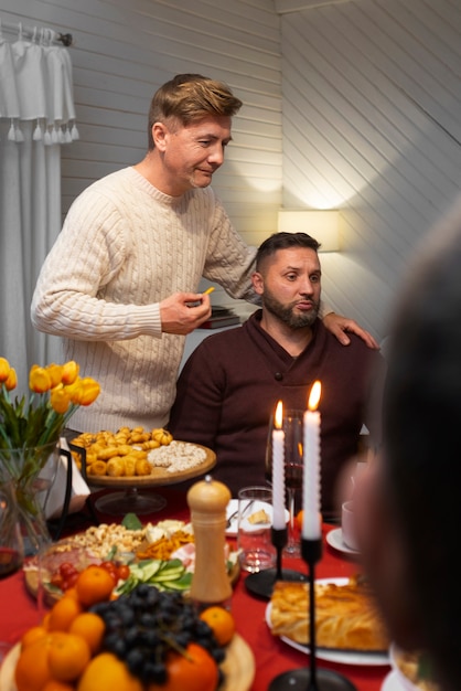 Free photo gay couple spending time with family