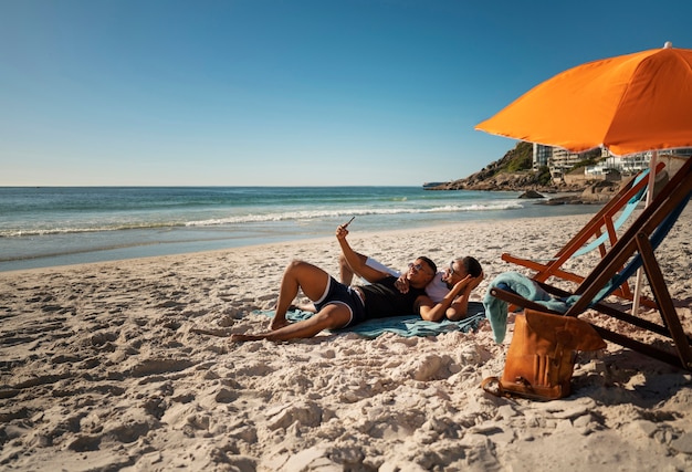 Gay male couple on the beach