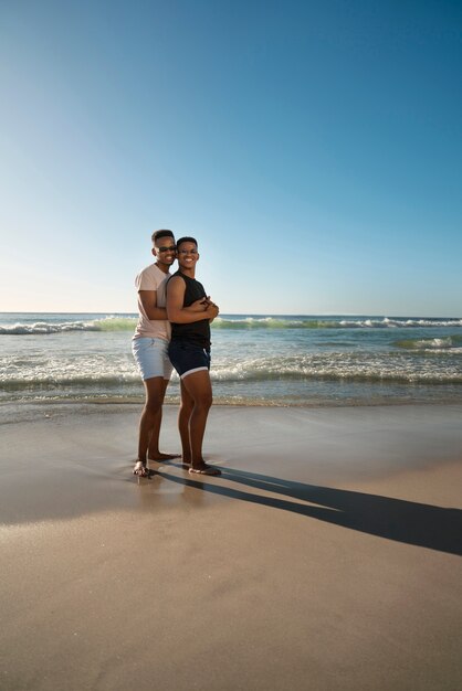 Gay male couple on the beach