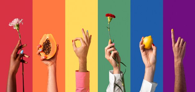 Gender fluid people hands on rainbow background