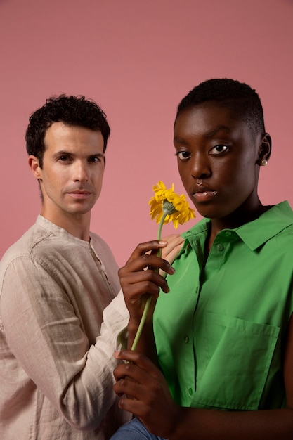 Gender fluid people posing in a pink studio