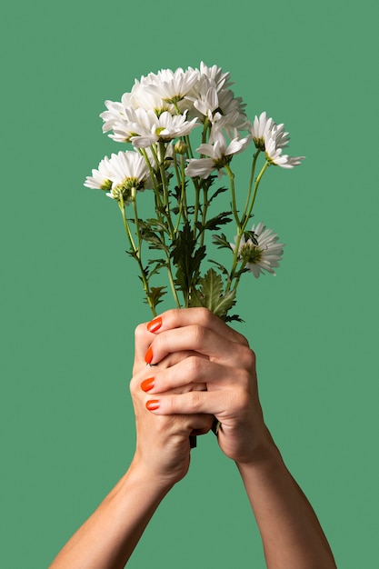 Gender fluid person hand isolated on green