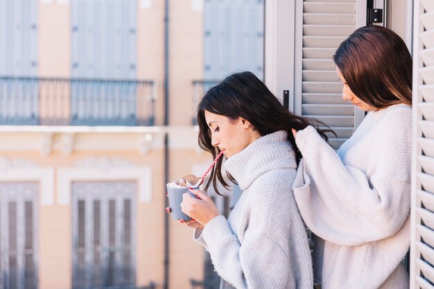 Gentle women spending time on terrace