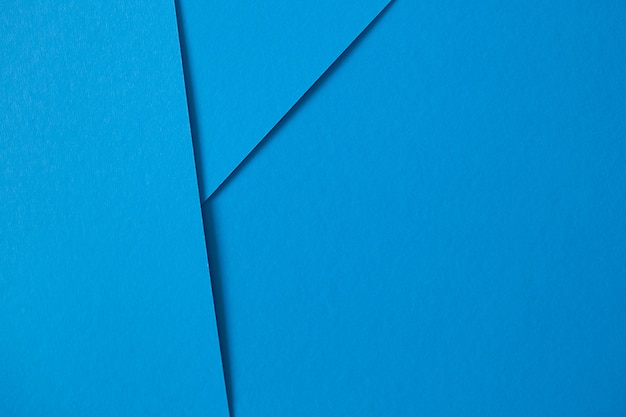 Geometric composition with blue paperboard with copyspace