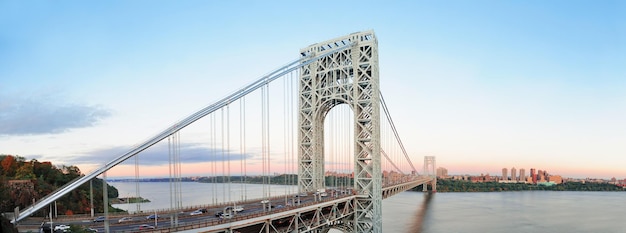 George Washington Bridge at sunset panorama over Hudson River.