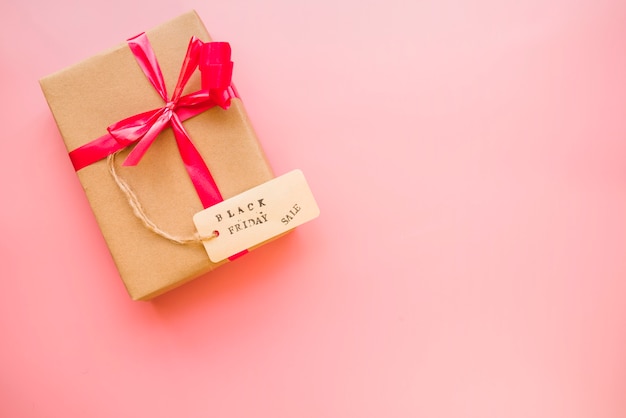 Free photo gift box with red bow and sale tag