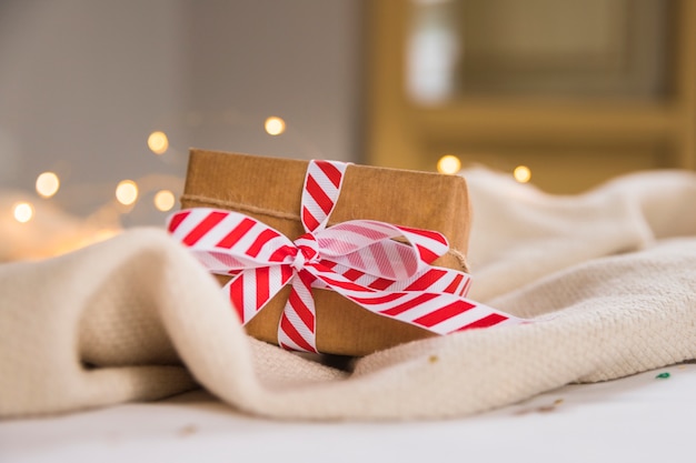 Free photo gift box with striped ribbon