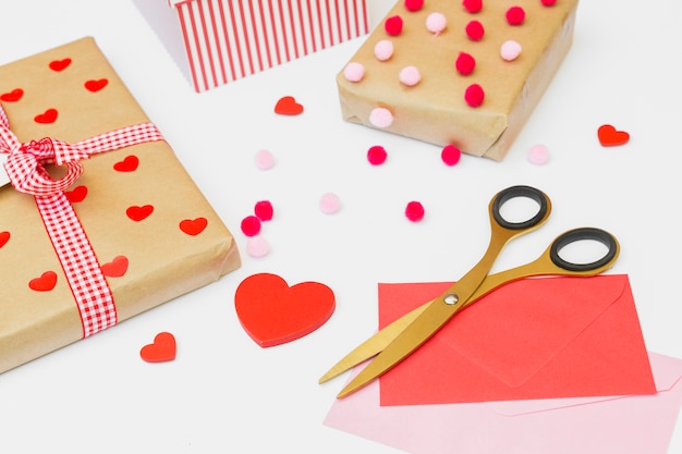 Gift boxes with envelopes on table