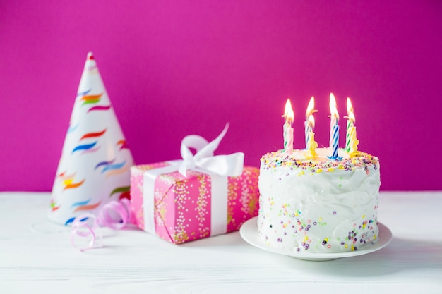 Giftbox with party hat and cake