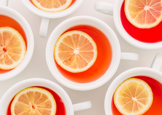 Ginger tea cup with lemon slice on white background