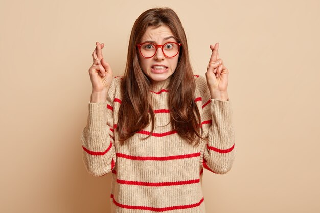 Ginger teenager wearing red eyeglasses