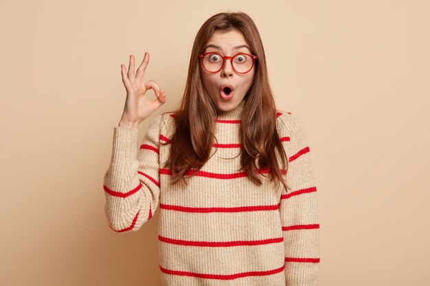 Ginger teenager wearing red eyeglasses