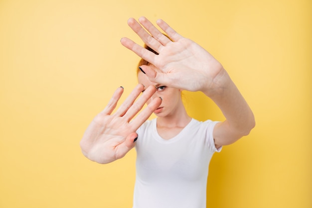 Free photo ginger woman doing stop gesture, no photos