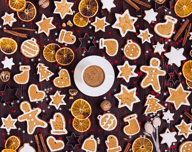 Gingerbread cookies cup of coffee christmas drink new year oranges cinnamon