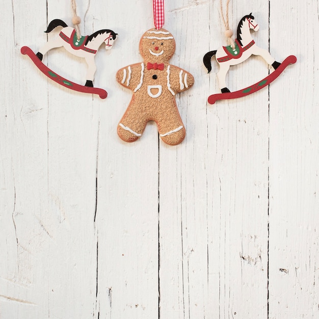 Gingerbread man and wooden horses with copy space