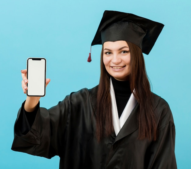 Girl in academic suit with phone