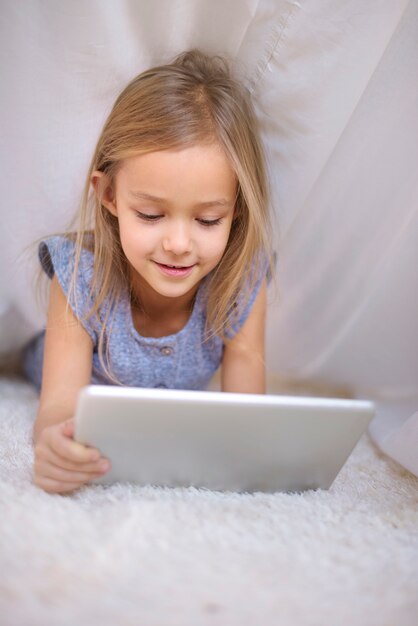 Girl affectionated with a digital tablet