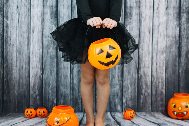 Girl in ballet skirt holding basket