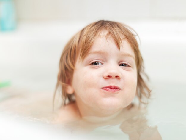 girl bathes in bath