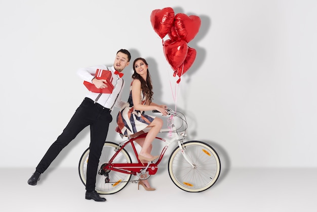 Girl on the bicycle and man next to her