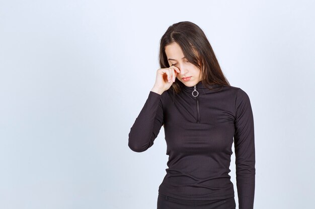 Girl in black clothes looks sad and depressed. 