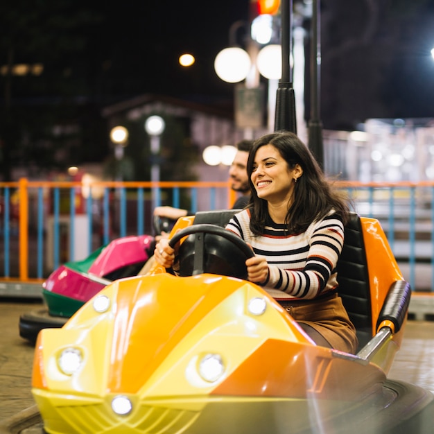 Free photo girl on bumper car