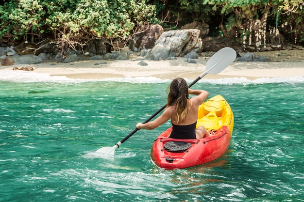 Free photo a girl on a canoe